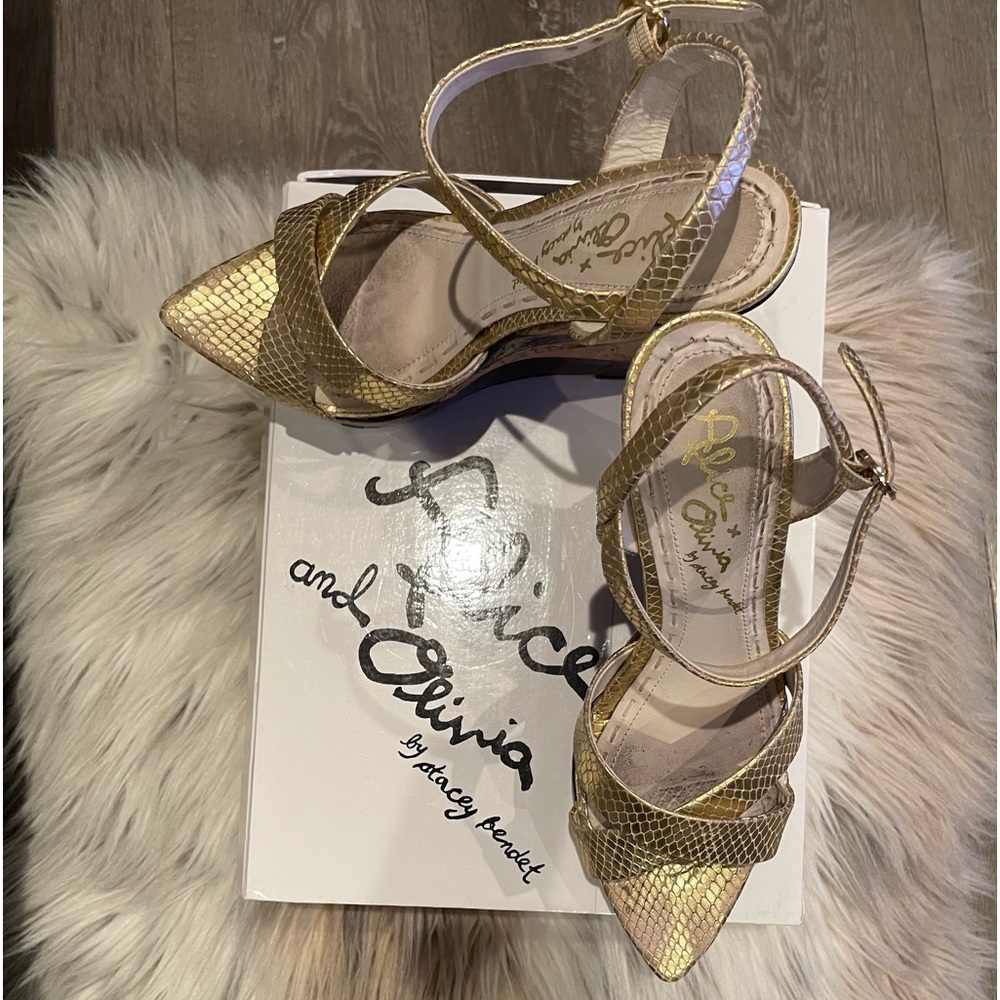 Alice and Olivia Wedges runs really small. Feels like 7-7.5.